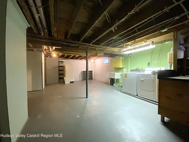 a front view of a house with a tree