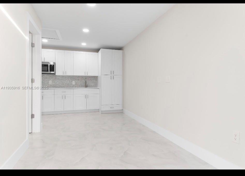 3202 Southwest 8th Street Lehigh Acres, FL 33976 - Photo 15 of 21 LIVING ROOM/ DINNING/KITCHEN