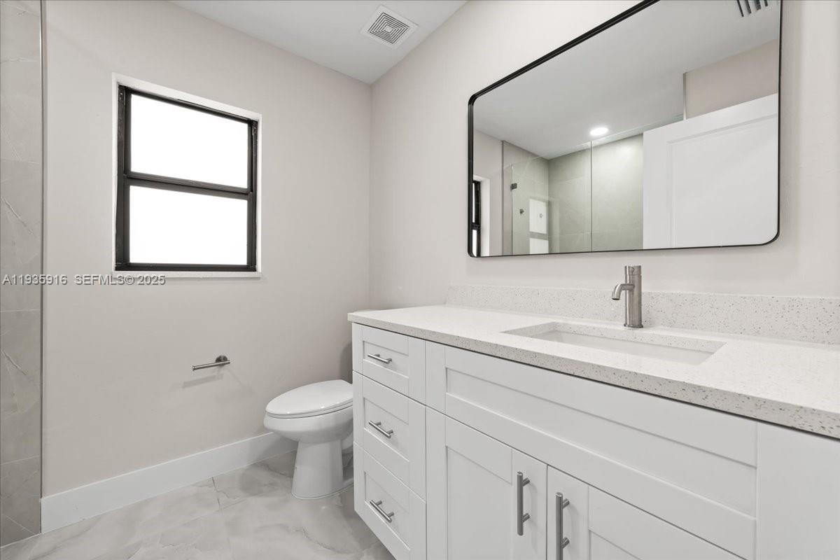 3202 Southwest 8th Street Lehigh Acres, FL 33976 - Photo 8 of 21 GUEST BATHROOM