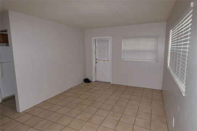 a view of an empty room and window