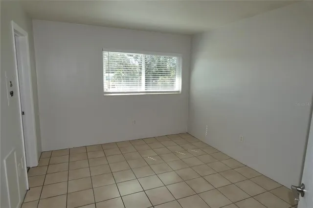 an empty room with white walls