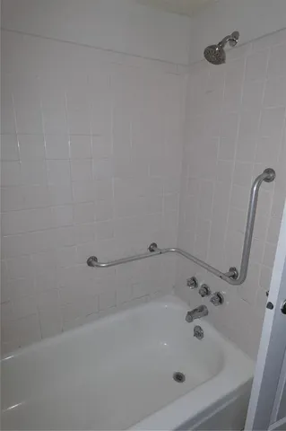 a white bath tub sitting in a bathroom
