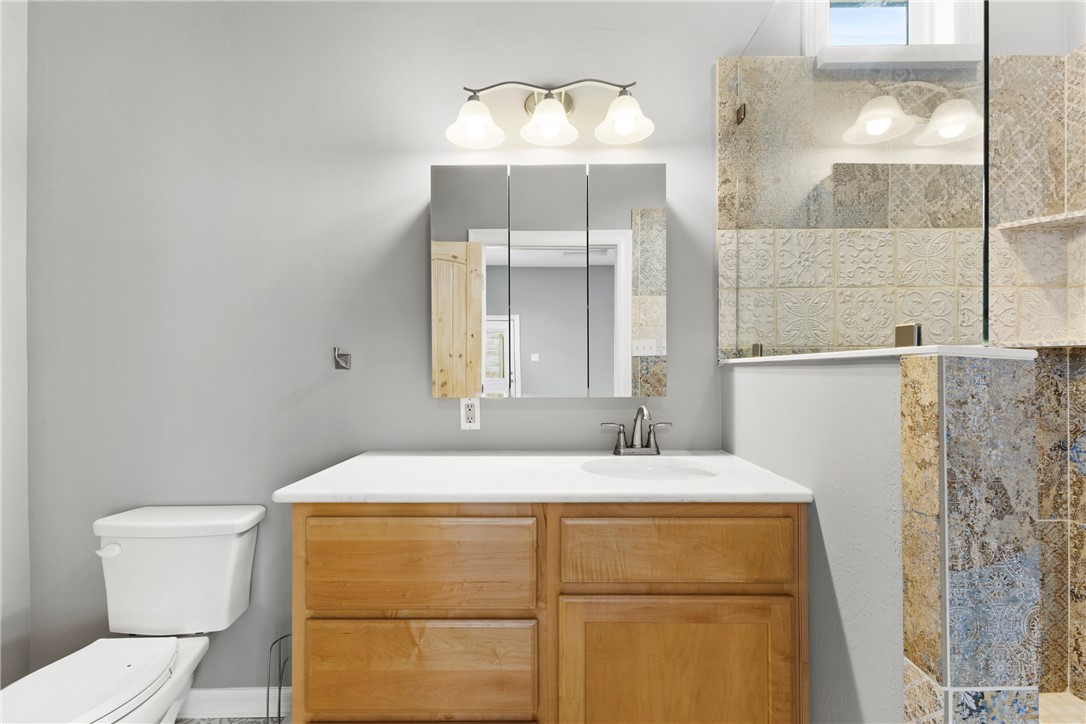 504 North Street Columbus, TX 78934 - Photo 19 of 29 Bathroom with walk in shower and vanity