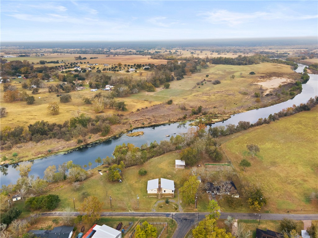 504 North Street Columbus, TX 78934 - Photo 20 of 29 Aerial view of property and surrounding area featuring a nearby body of water