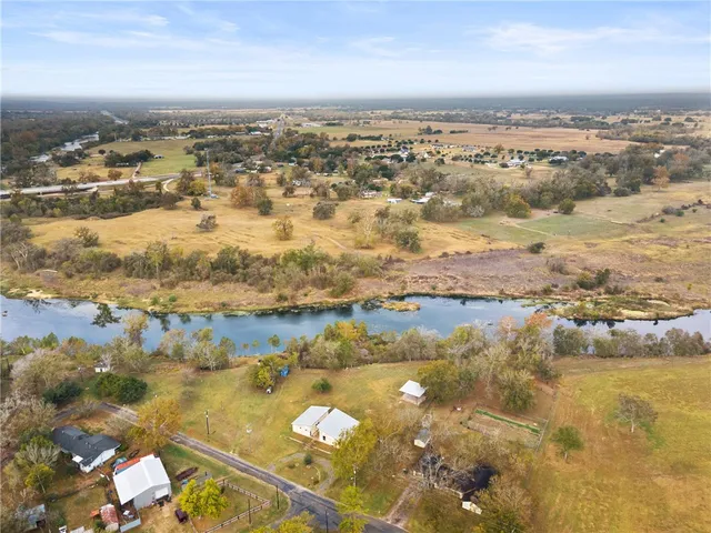 an aerial view of residential building and ocean