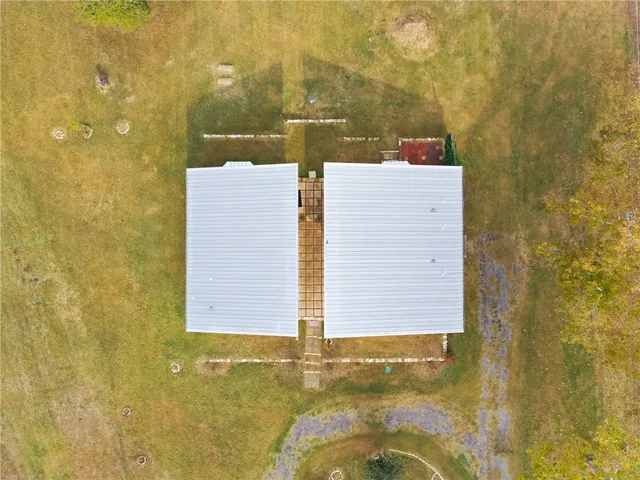 a view of lawn chairs under an umbrella