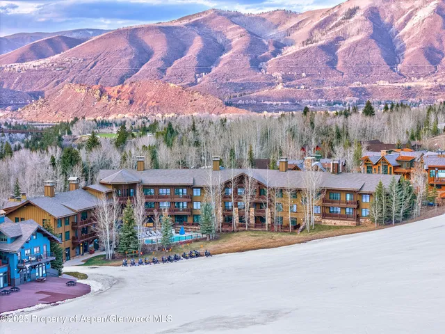 a front view of a building with a yard