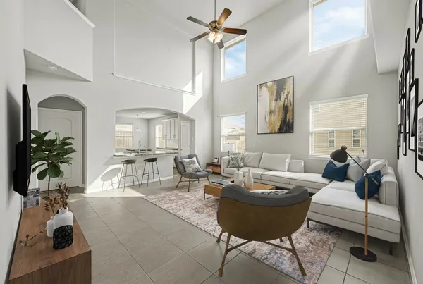 a living room with furniture a chandelier and a window