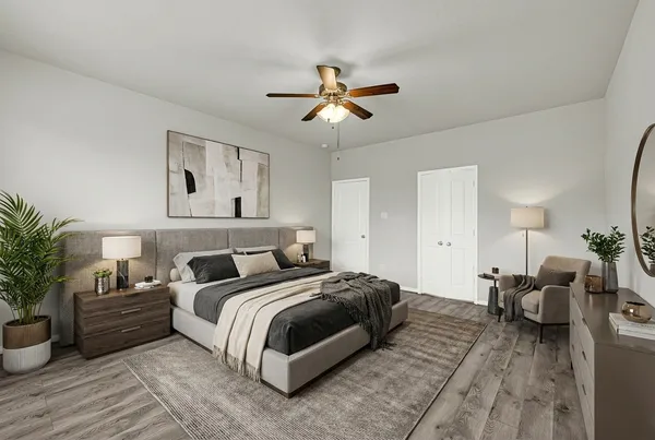 a bedroom with bed and a chandelier