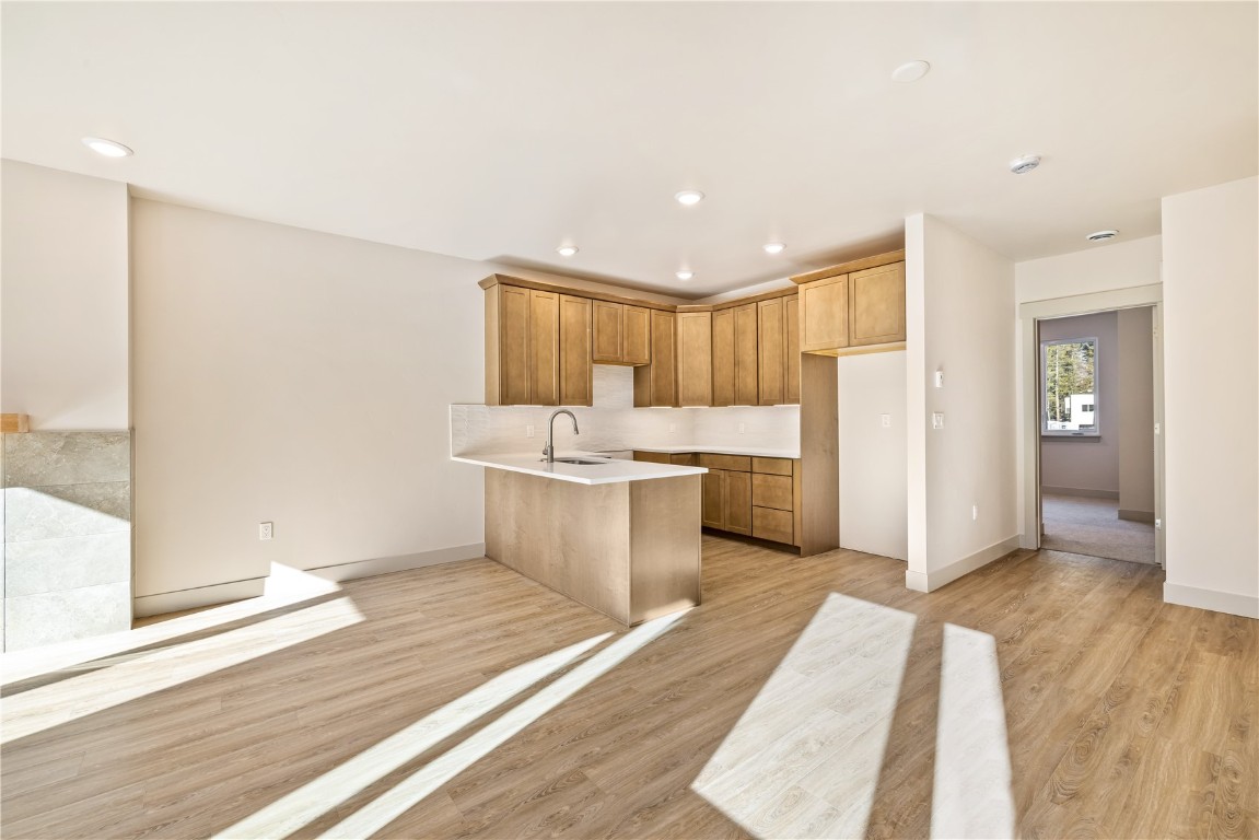 632 Montezuma Road, Unit C2 Keystone, CO 80435 - Photo 12 of 36 a large white kitchen with a sink and refrigerator