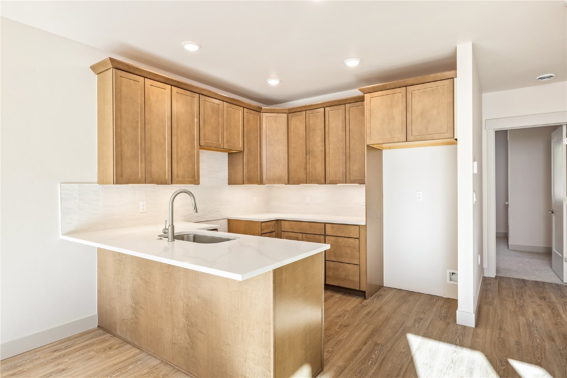 632 Montezuma Road, Unit C2 Keystone, CO 80435 - Photo 15 of 40 a kitchen with a sink cabinets and wooden floor