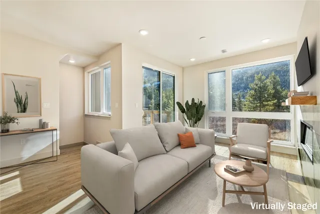 a living room with furniture and a large window