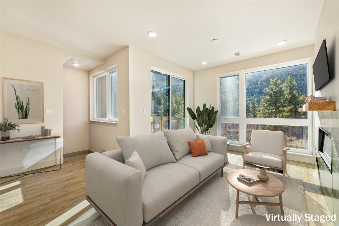 632 Montezuma Road, Unit C2 Keystone, CO 80435 - Photo 2 of 40 a living room with furniture and a large window