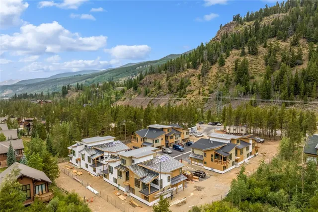 a view of a lake with couches and city view