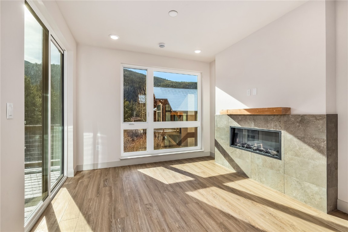 632 Montezuma Road, Unit C2 Keystone, CO 80435 - Photo 5 of 36 a view of an empty room with a fireplace and a window