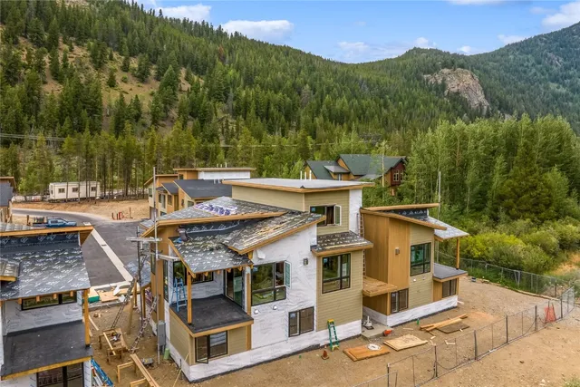 an aerial view of a house with a big yard