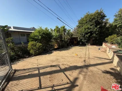 a view of a backyard of the house