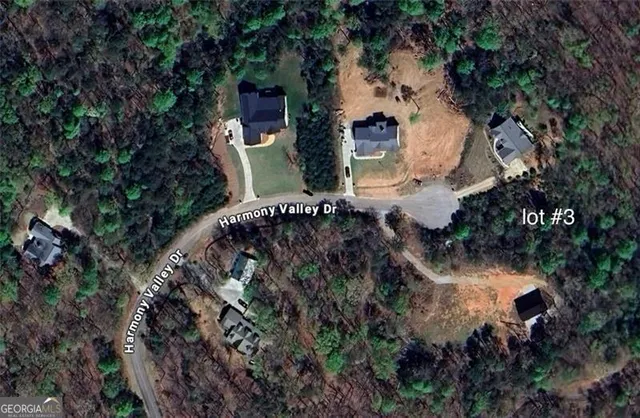 an aerial view of house with yard and outdoor seating