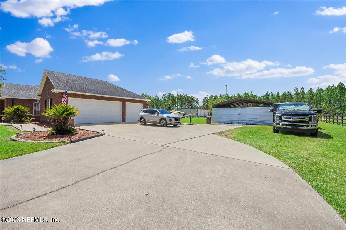 35440 Quail Road Callahan, FL 32011 - Photo 27 of 34 a view of a house with a yard
