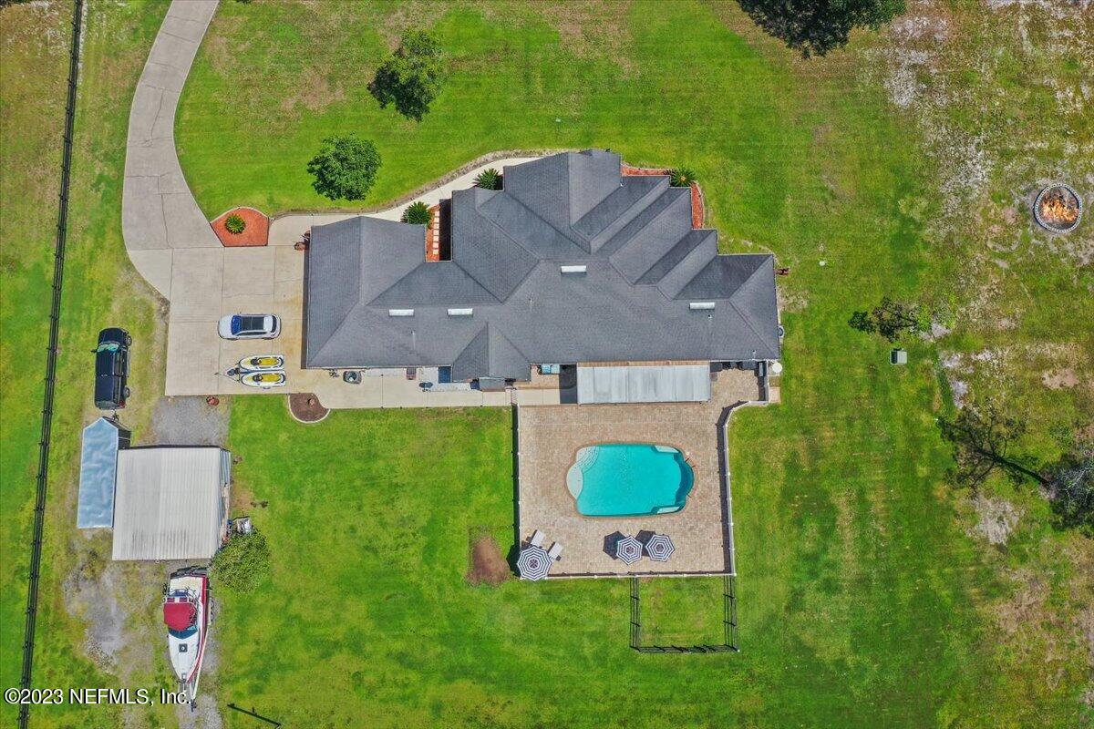 35440 Quail Road Callahan, FL 32011 - Photo 33 of 34 an aerial view of a house with a garden and swimming pool
