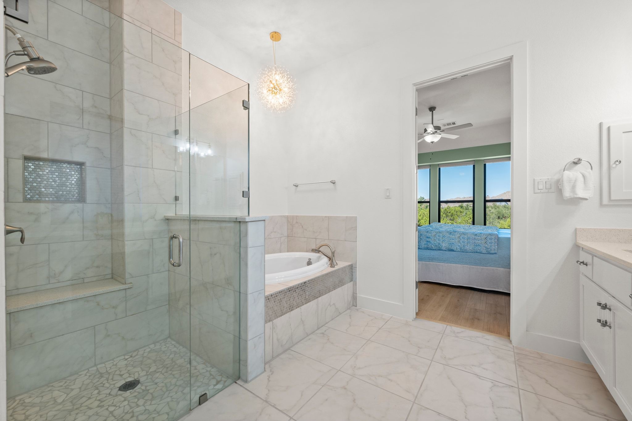 7804 Pace Ravine Drive Lago Vista, TX 78645 - Photo 16 of 34 a spacious bathroom with a bathtub shower and sink