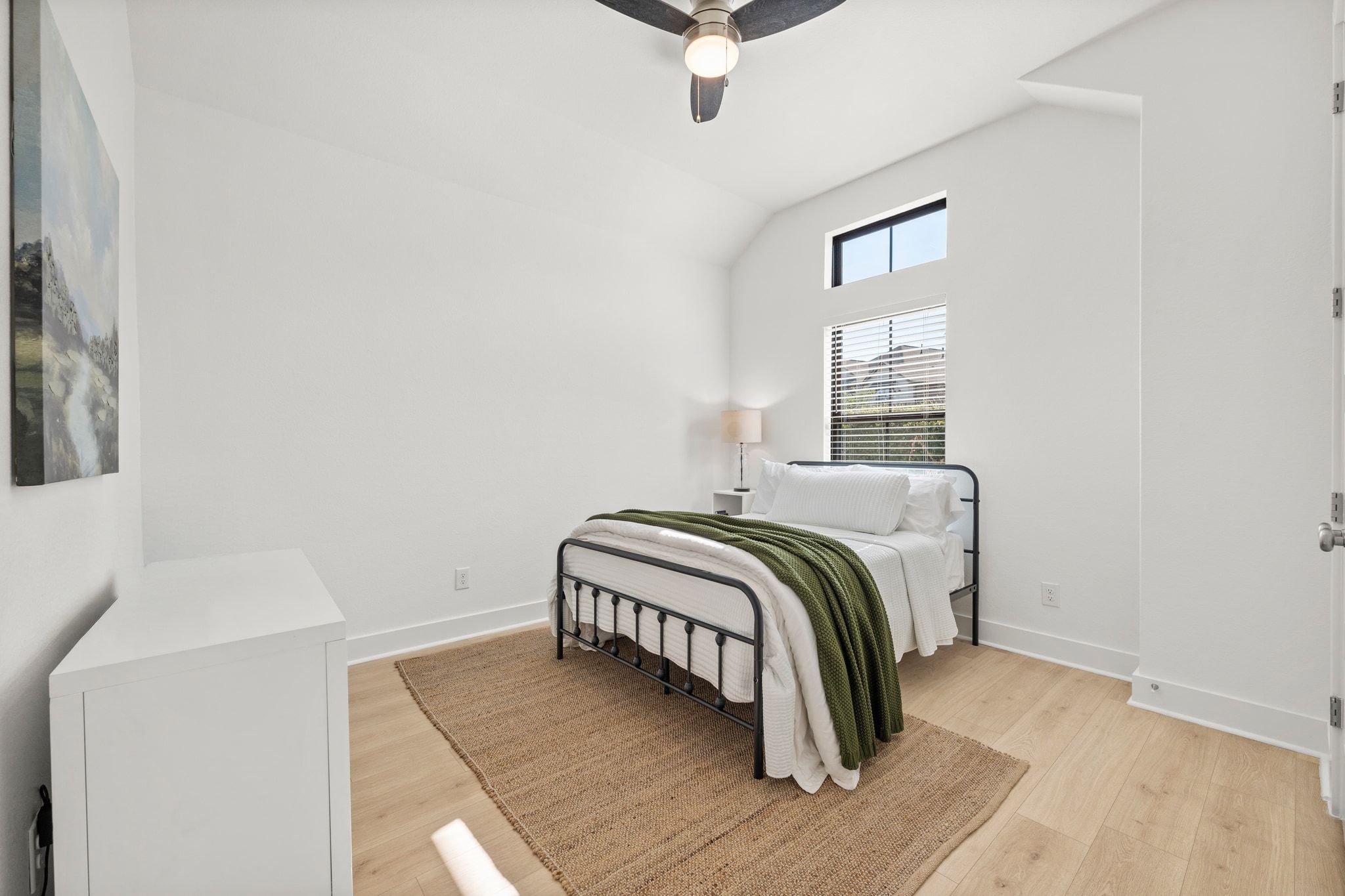 7804 Pace Ravine Drive Lago Vista, TX 78645 - Photo 21 of 34 a bedroom with a bed and a window