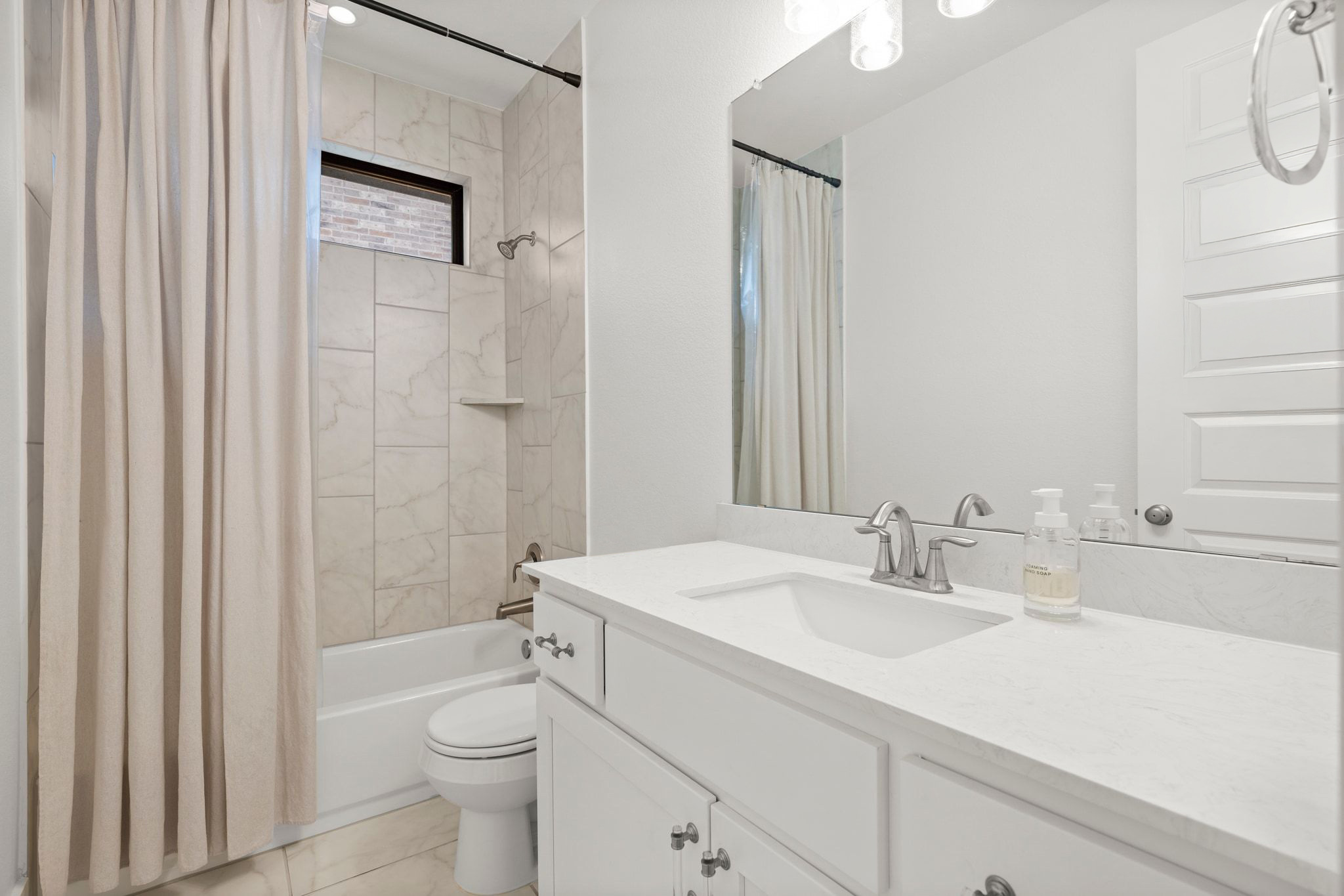 7804 Pace Ravine Drive Lago Vista, TX 78645 - Photo 23 of 34 a bathroom with a sink a toilet and shower