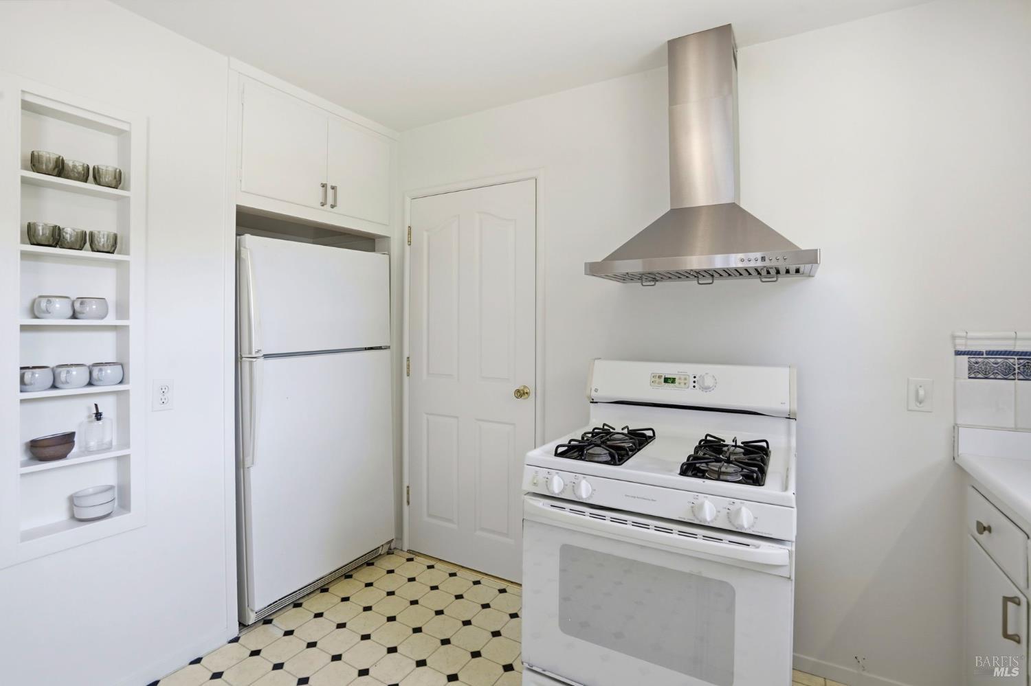 234 Solano Street San Rafael, CA 94901 - Photo 16 of 24 a kitchen with a refrigerator and a stove