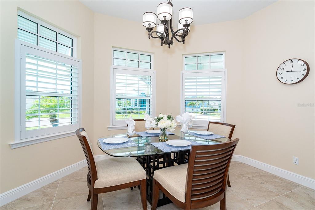 8952 Scallop Way Placida, FL 33946 - Photo 11 of 52 a view of a dining room with furniture window and outside view
