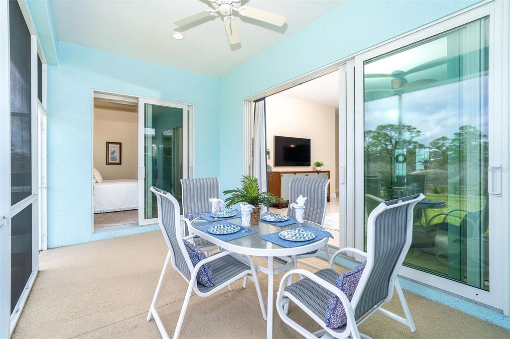 8952 Scallop Way Placida, FL 33946 - Photo 19 of 52 a view of a dining room with furniture window and wooden floor