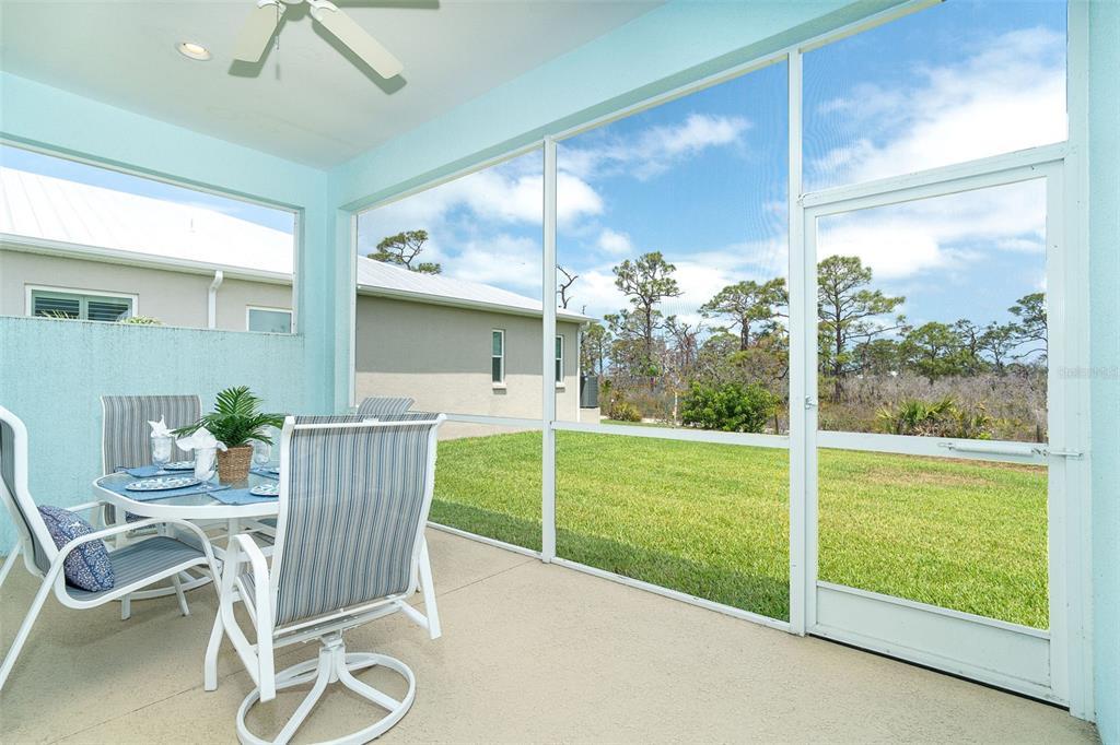 8952 Scallop Way Placida, FL 33946 - Photo 21 of 52 a view of a porch with furniture and garden