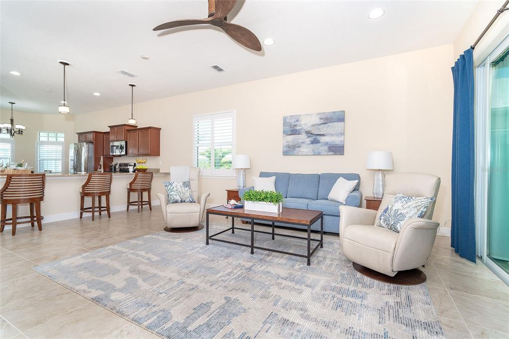 8952 Scallop Way Placida, FL 33946 - Photo 28 of 52 a living room with furniture and a chandelier