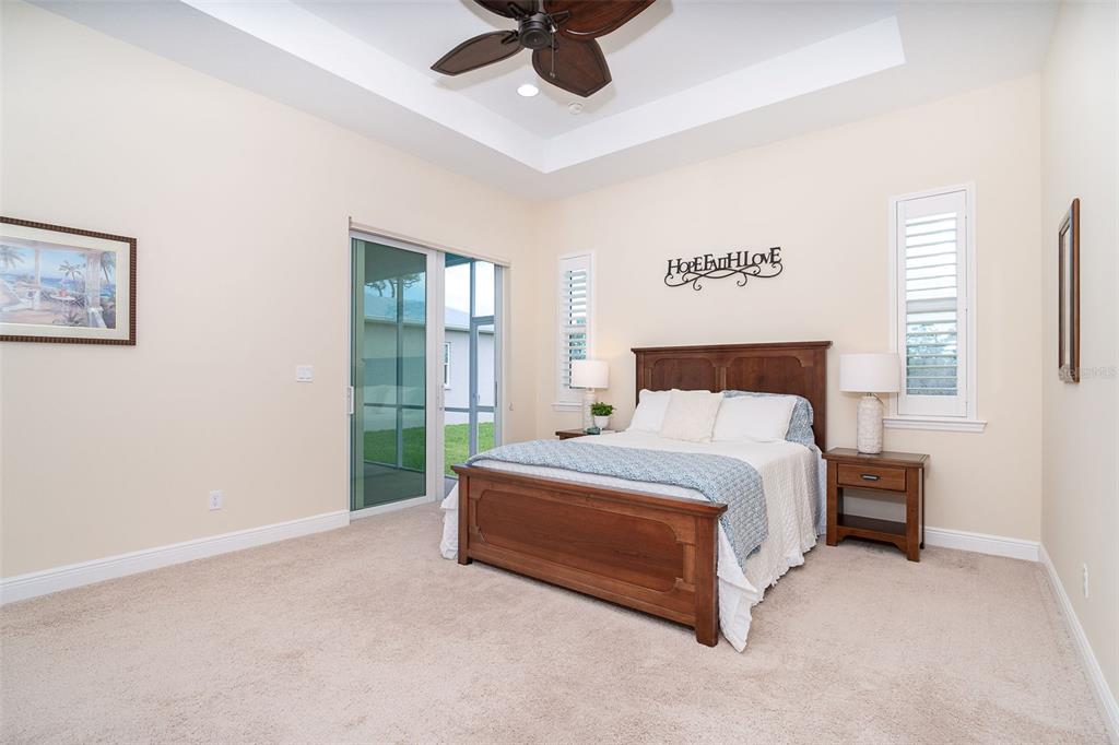 8952 Scallop Way Placida, FL 33946 - Photo 29 of 52 a spacious bedroom with a bed and a window