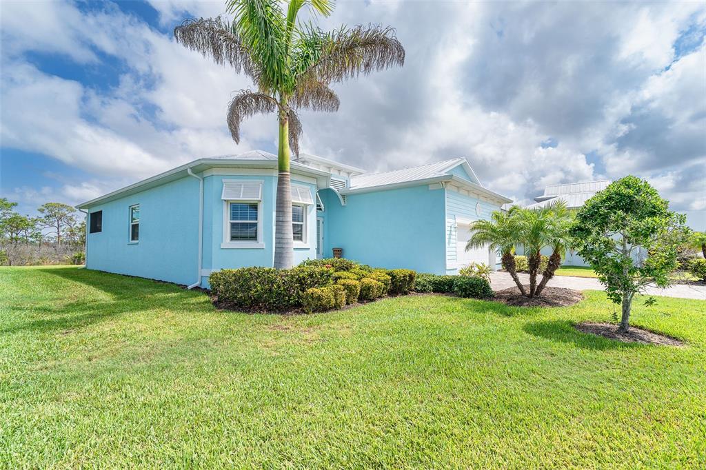 8952 Scallop Way Placida, FL 33946 - Photo 3 of 52 a view of a porch with a yard