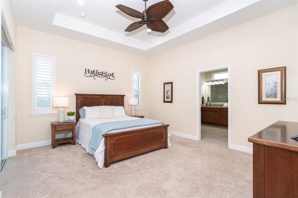 8952 Scallop Way Placida, FL 33946 - Photo 31 of 52 a spacious bedroom with a bed and ceiling fan