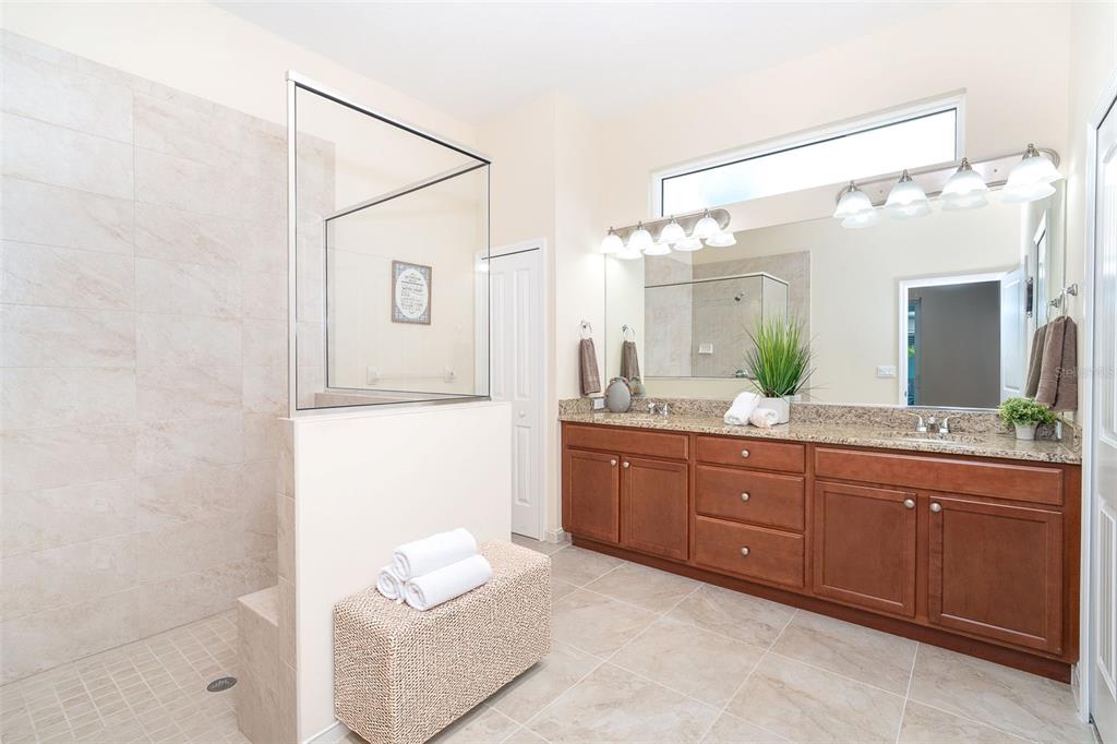8952 Scallop Way Placida, FL 33946 - Photo 32 of 52 a spacious bathroom with a granite countertop sink mirror and a
