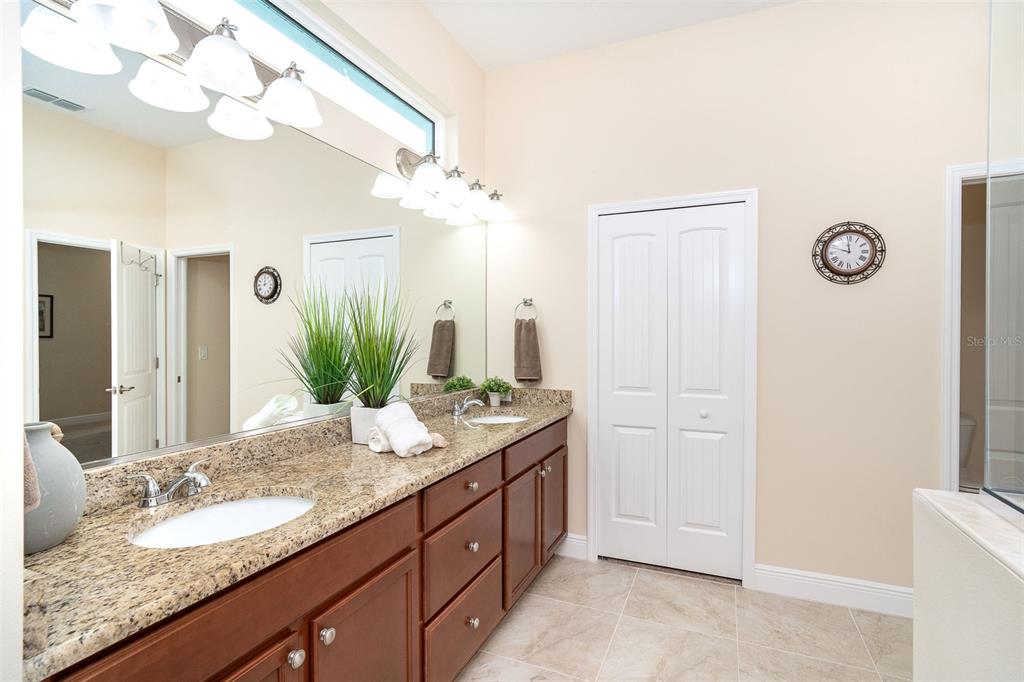 8952 Scallop Way Placida, FL 33946 - Photo 34 of 52 a bathroom with a granite countertop sink and a mirror
