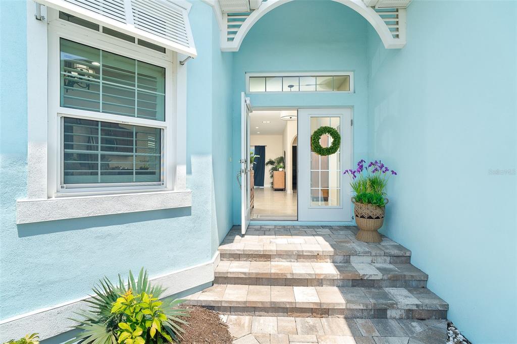 8952 Scallop Way Placida, FL 33946 - Photo 5 of 52 a front view of a house with a potted plant