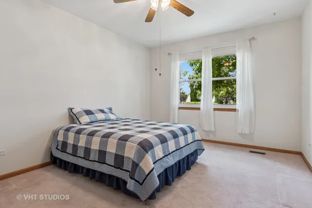 a bathroom with a large window and a sink