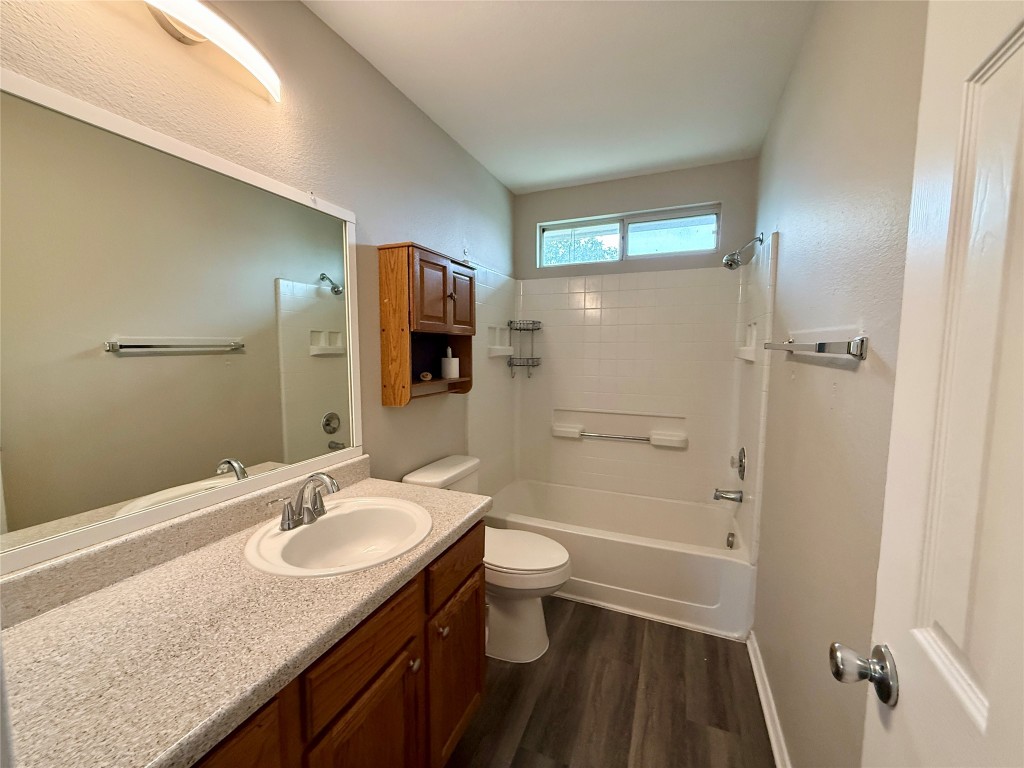 17212 Hamilton Point Circle Manor, TX 78653 - Photo 14 of 27 a bathroom with a sink a toilet and shower