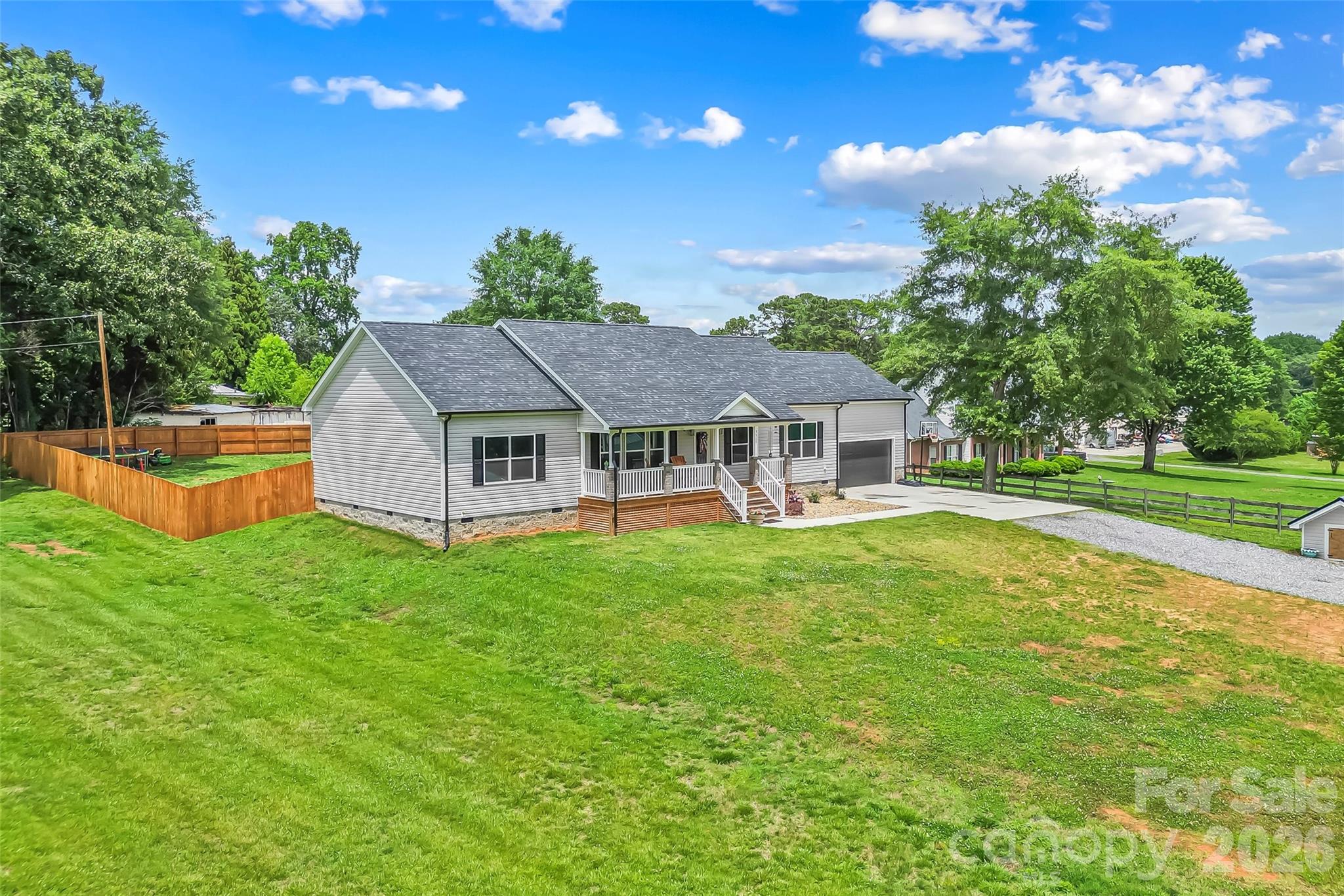 3511 Randleman Road Iron Station, NC 28080 - Photo 2 of 31 a aerial view of a house with swimming pool and a yard