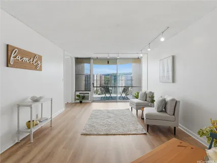 a living room with furniture and a large window