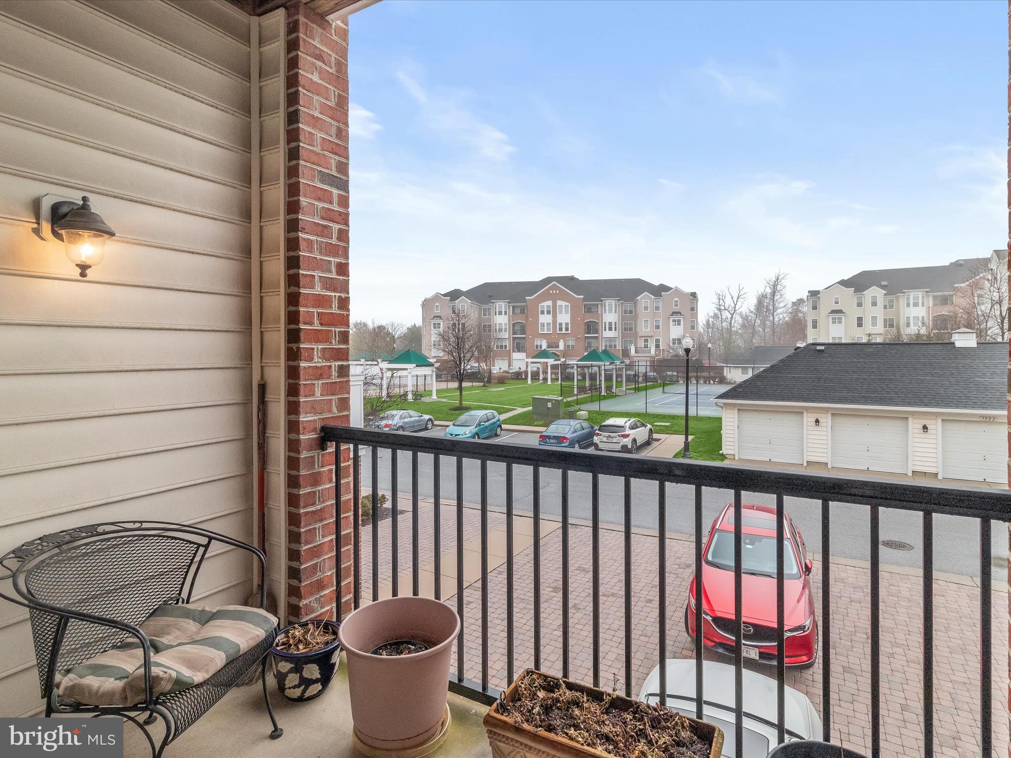 7325 Brookview Road, Unit 208 Elkridge, MD 21075 - Photo 13 of 31 a view of a balcony with chair and city view