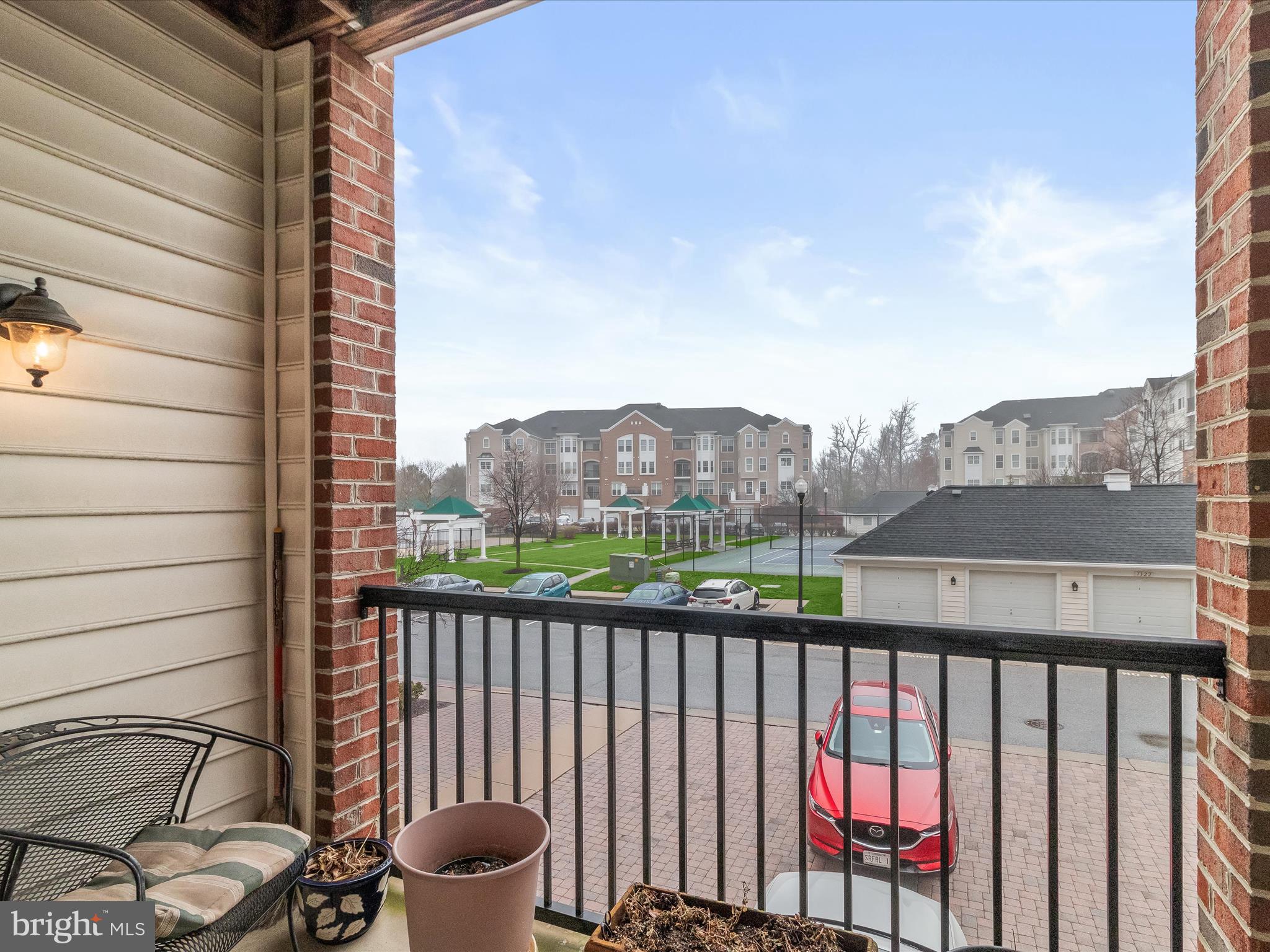 7325 Brookview Road, Unit 208 Elkridge, MD 21075 - Photo 14 of 31 a view of a balcony with an outdoor seating
