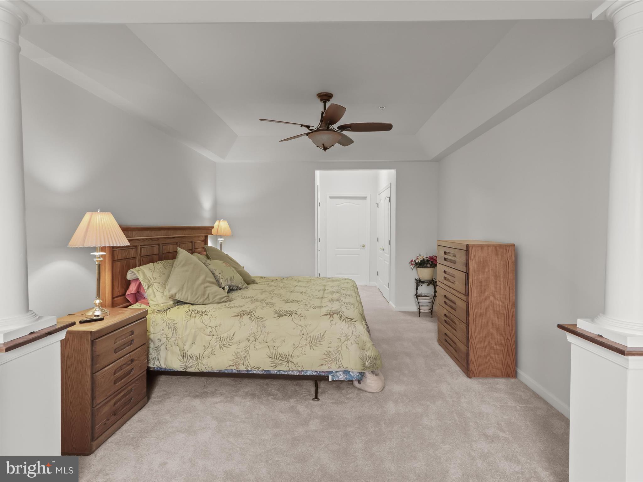 7325 Brookview Road, Unit 208 Elkridge, MD 21075 - Photo 16 of 31 a bedroom with a bed and a chandelier