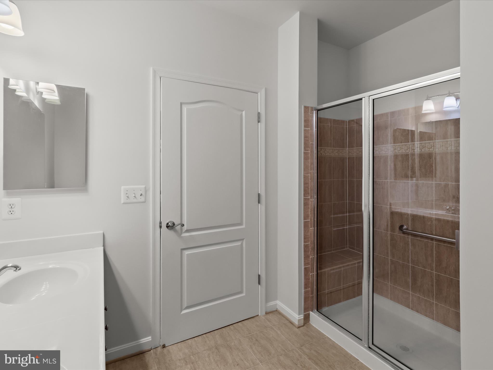 7325 Brookview Road, Unit 208 Elkridge, MD 21075 - Photo 20 of 31 a bathroom with a shower and a sink