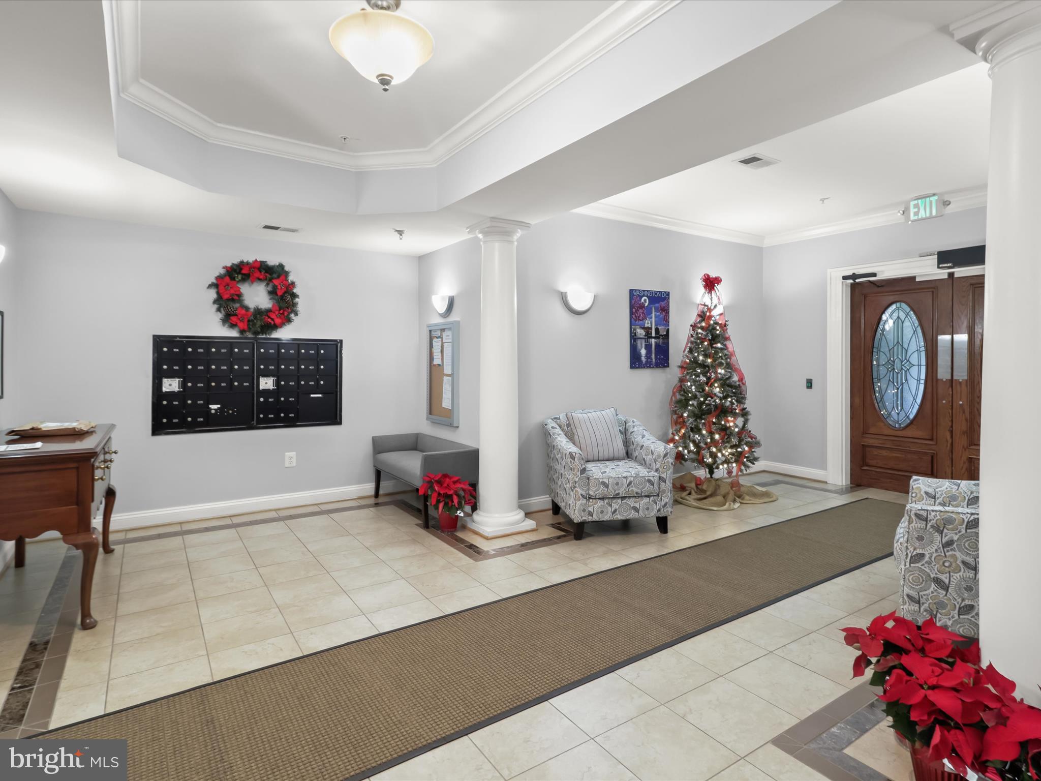 7325 Brookview Road, Unit 208 Elkridge, MD 21075 - Photo 2 of 31 a living room with furniture and a chandelier