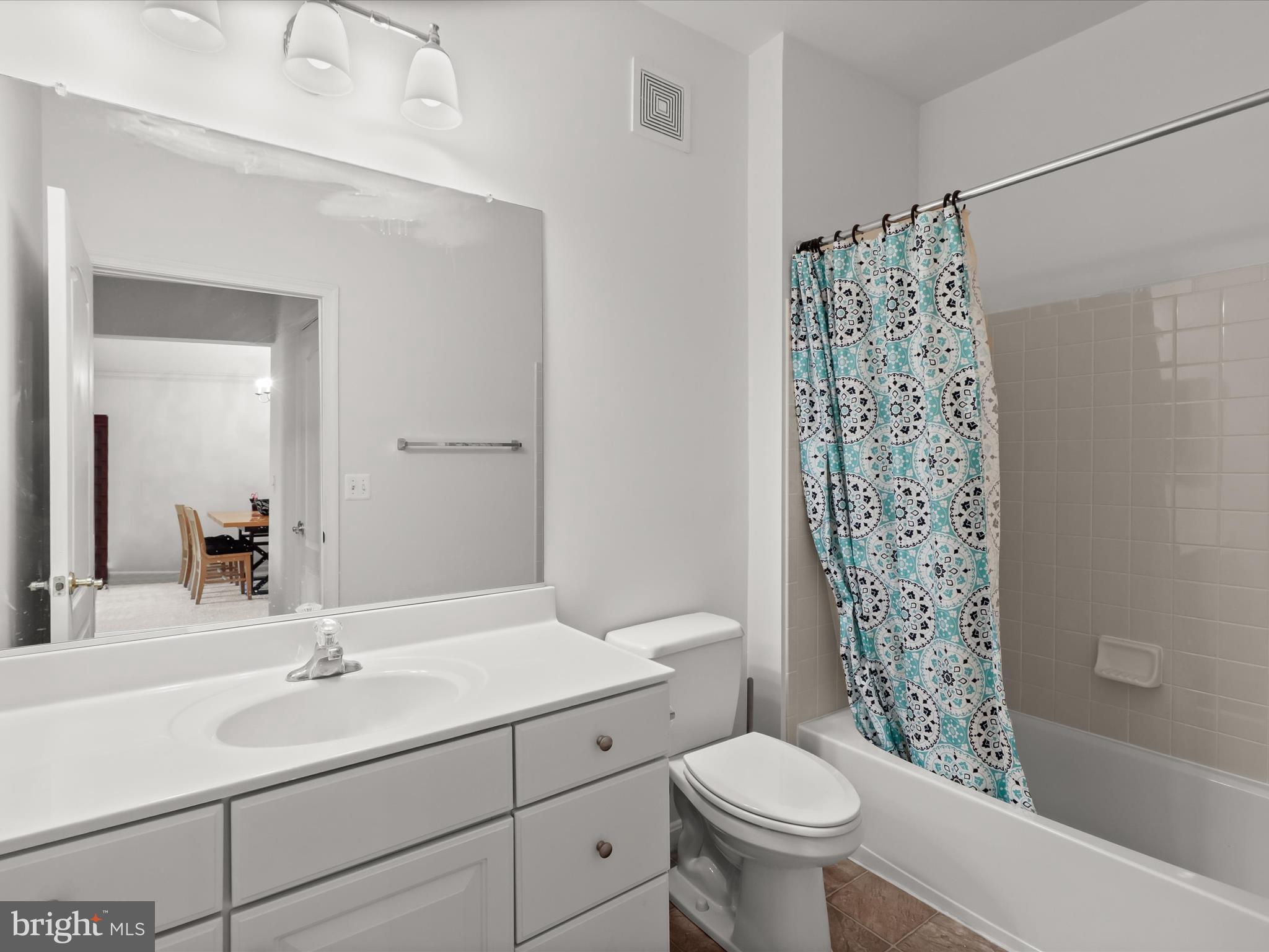 7325 Brookview Road, Unit 208 Elkridge, MD 21075 - Photo 27 of 31 a bathroom with a sink toilet and shower