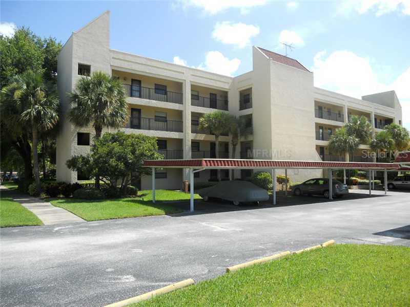 11485 Oakhurst Road, Unit 302 Largo, FL 33774 - Photo 1 of 1 Exterior Front - Front view looking at 3rd floor unit and assigned parking space #3