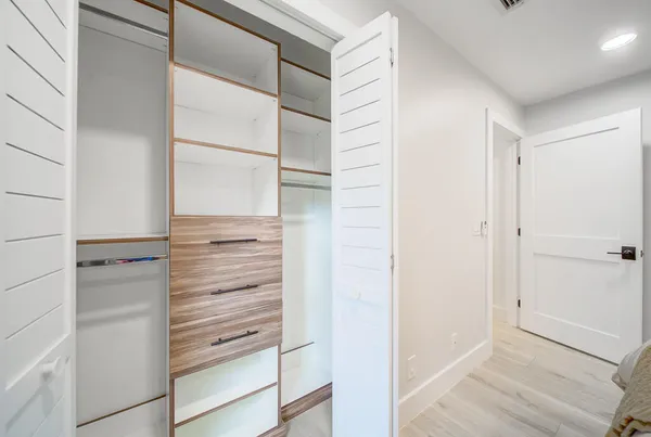 a view of walk in closet and stairs